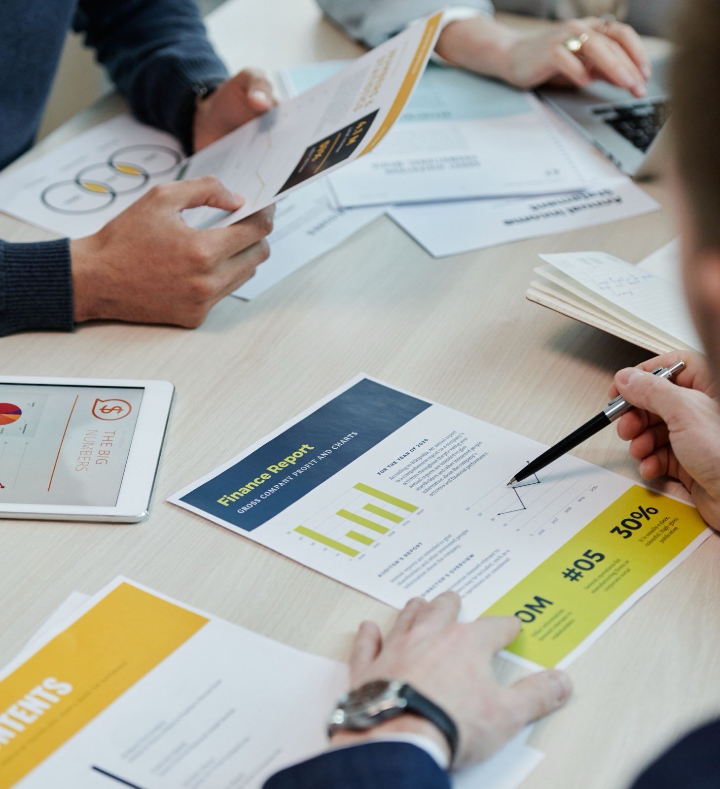 A printed financial report being reviewed